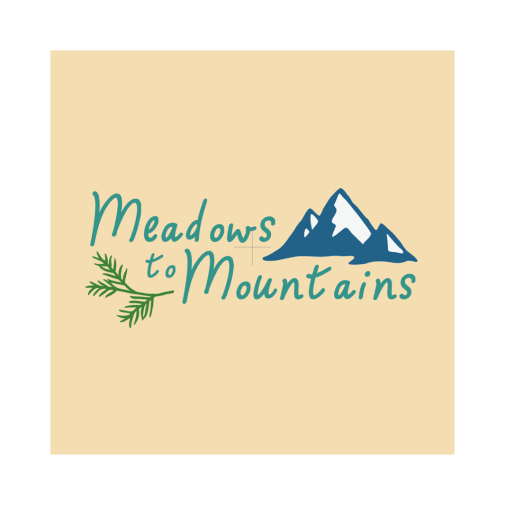 Tan background. Meadows to Mountains in blue lettering, with illustrations of snow-capped mountains and a small pine branch.