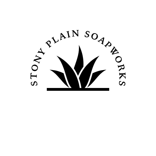 Stony Plain Soapworks in black capital lettering in a curve over a simple illustrated agave catus with a line underneath.